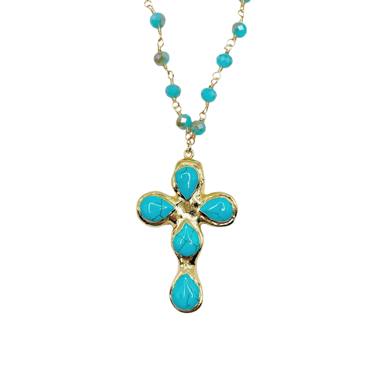 A gold cross pendant necklace featuring five turquoise blue teardrop-shaped stones, suspended from a matching turquoise beaded chain on a white background.