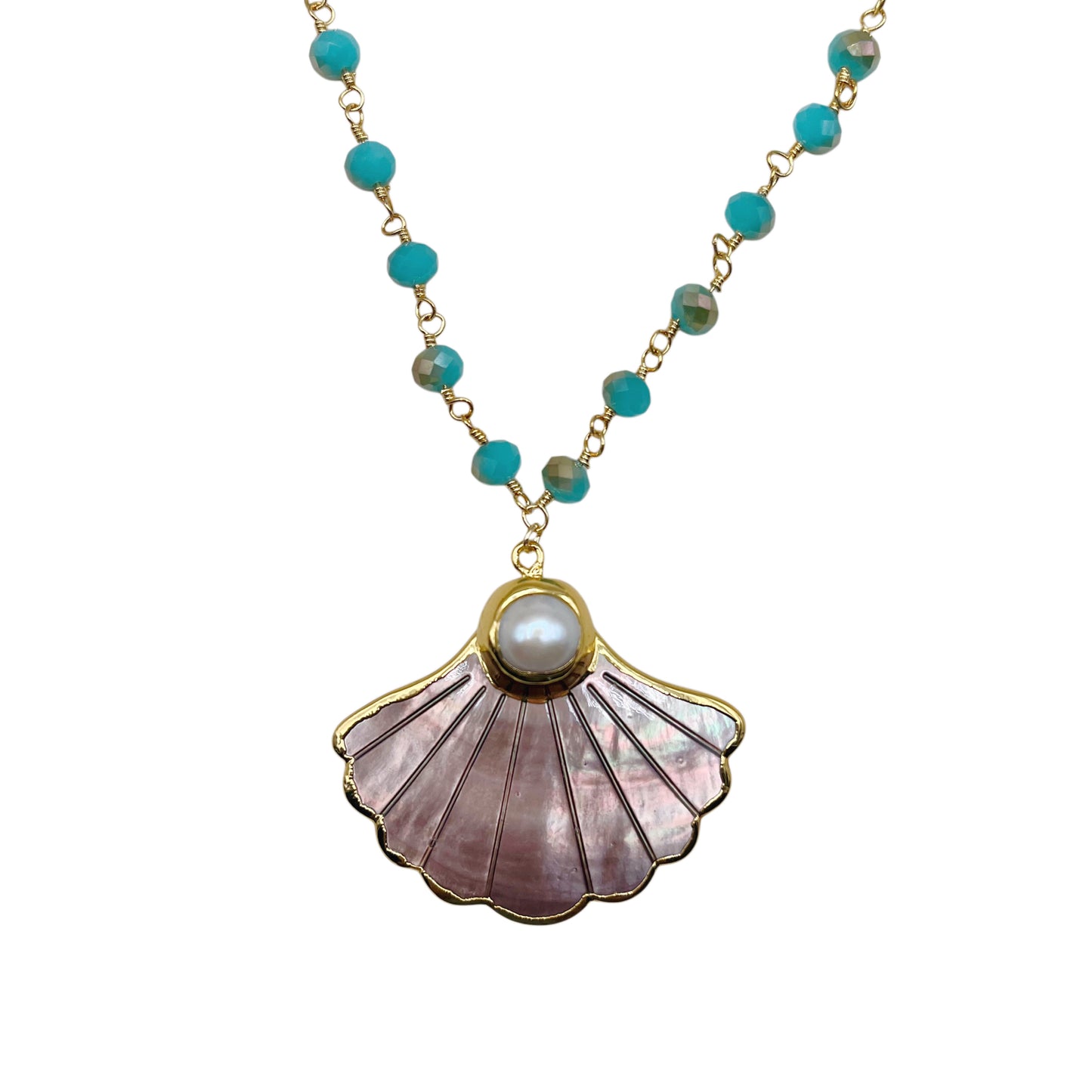 A gold-tone necklace featuring a scallop shell pendant made of iridescent pink mother-of-pearl with a white pearl at the center, accented by small turquoise beads on a gold chain, shown against a plain white background.